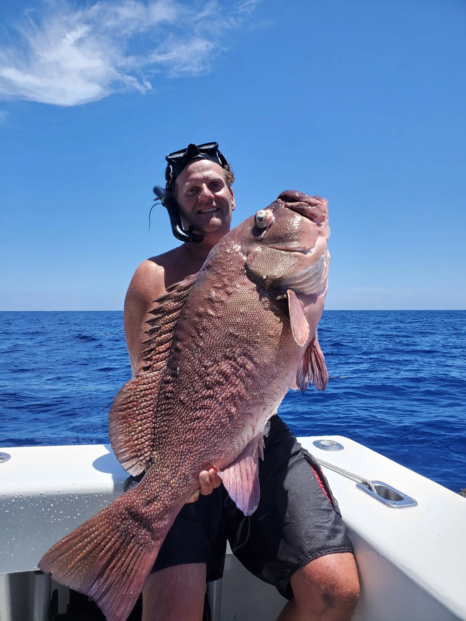 Angler with a big red grouper