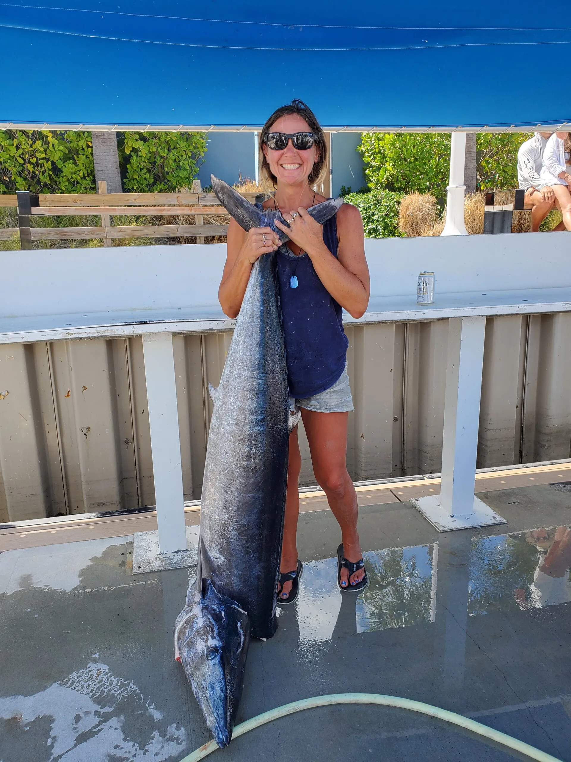 Angler with a billfish at the dock