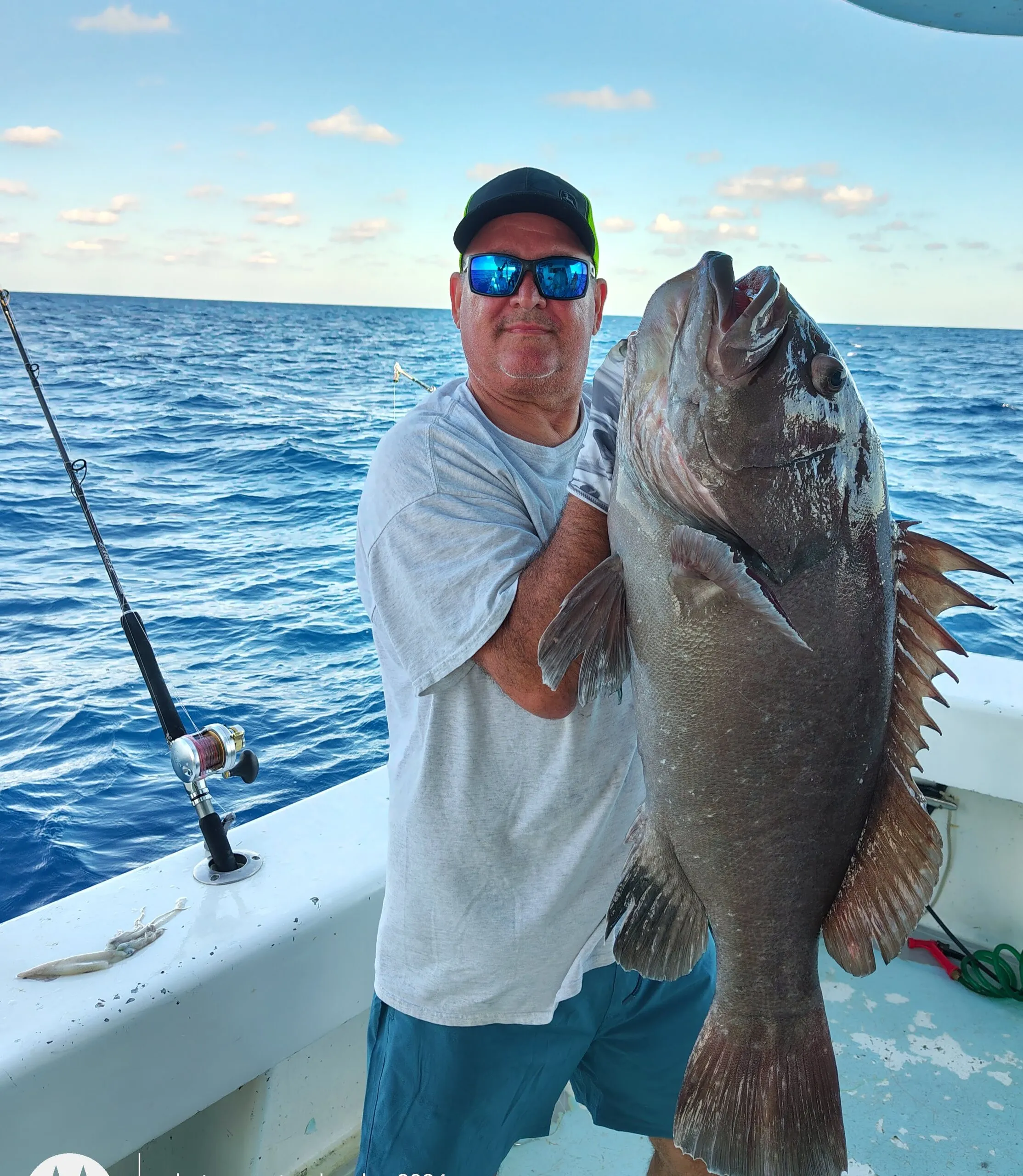 Angler with a giant grouper
