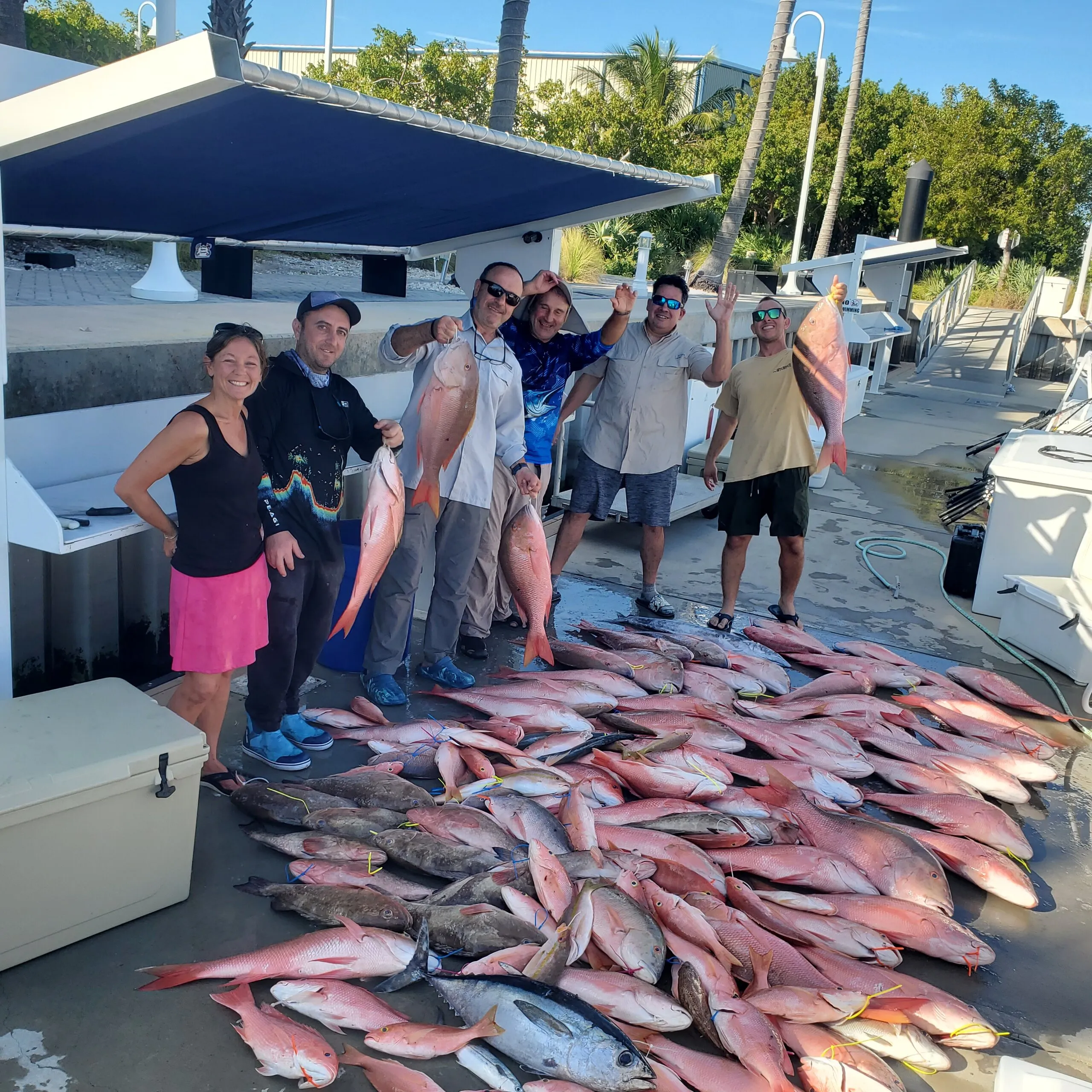 Group behind a dock full of snapper